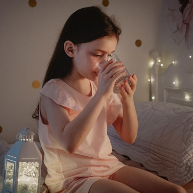 Girl drinking water at bedtime