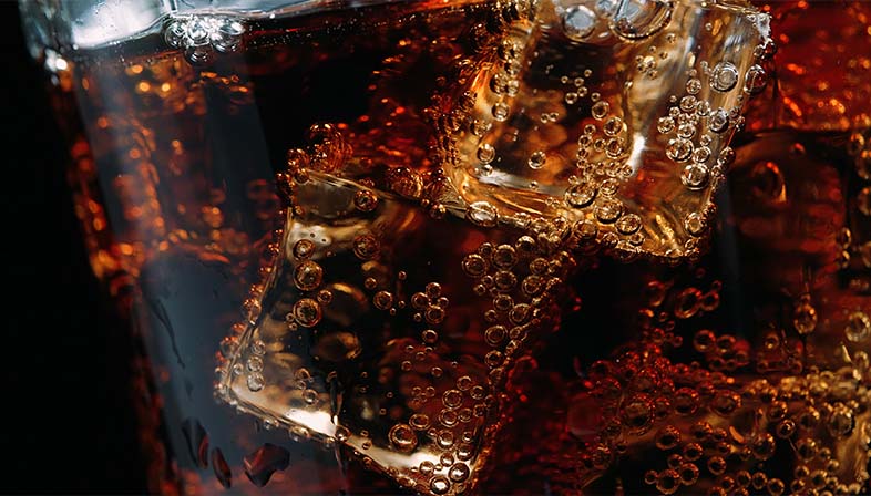 Ice cubes in a glass of cola