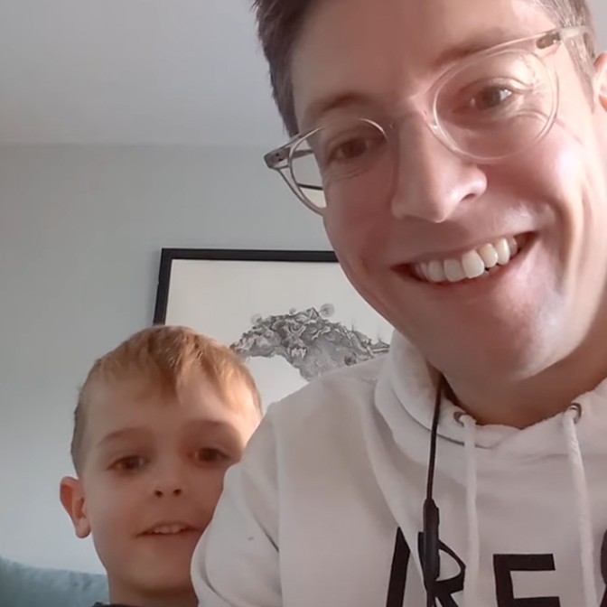 Smiling father and son